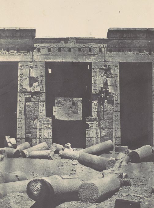 Salt print of man sitting among ancient Egyptian ruins